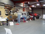 Another general shot: two Lynx's to the left, and a red-white Westland Scout in the background. The sand-brown camouflage Lynx at left set the world speed record for a helicopter, 249mph, in 1986, a record that still stands today.