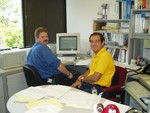 Here you go I am working over here, honest! This is a picture of me sitting in front of a SUN Unix workstation.

I can say I am developing a dislike for SUN Unix it is very old and inflexible.

The guy in the yellow shirt is my boss Sergio over here, this is his office.