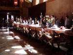 Next door to the ballroom is the dining room which contains one VERY long table. The candlesticks were impressive, about 3-4 feet high. To the right of the photo near the end of the table was a massive fireplace, big enough for most people to walk in and out of without bumping their head... especially those of us under 6 feet tall! Along the windows were antiques flags. This room had a very medieval feel to it. After dinner the guests would play billiards for a while then go watch a movie in the inhouse theatre.