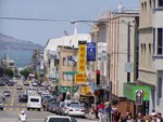 Rod, who was hanging off the side of the Cable Car, took this photo of a street in San Fransisco's Chinatown district. The Golden Gate Bridge is out of view further to the left of the photo.