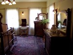 An example of one of the bedrooms, with period furniture. The owner's heiress hocked off most of the furniture so these pieces aren't original but are from the same (Victorian) period. The furniture, when removed from the house for sale, took 8 trucks working 24/7 for 6 weeks to empty the house! Of course, trucks were somewhat smaller back in the 1920's...