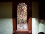 This beautiful window is the most expensive in the entire house, it cost $1500 to make back in the late 19th century. You can multiply that by 100 to give some estimation of its making cost today. The green wall covering is made of pressed wood-pulp and today goes for about $500 (US) per square foot...