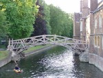 This bridge is famous for originally being constructed without and nails, nuts or bolts.  Safety and Health got hold of it, though, and now it does...!  It still connects to Queens' College buildings.