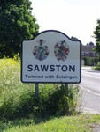 The Sawston town sign complete with crests.