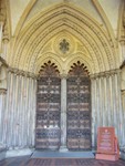 The cathedral's main doors.  If you look closely there is a smaller door within the left door, and it stands about 6 feet high - the small door, that is...