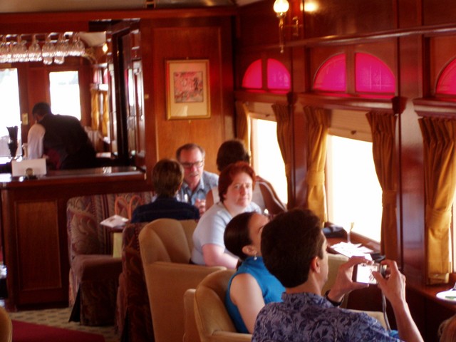 Here is Karen in the pre-dining carriage enjoying her glass of wine.  And the scintillating conversations (not!) of those around her while I take this photo!