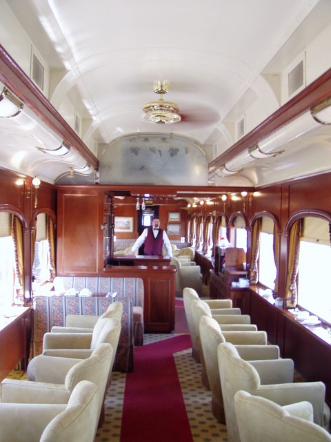 This is a view of inside the train and one of the Bar staff.  They were very nice waiting staff and the carriages were nicely done up too!