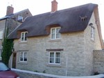 Bampton - house (4).  Spot the visitor on the thatch...