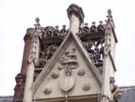 A close up of the intricate carving on the building.